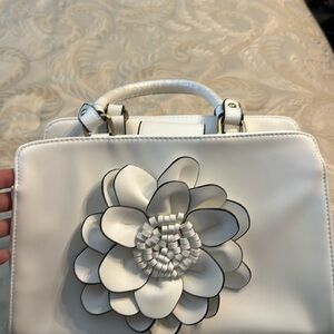 White EY Botique  white purse with flower. New with plastic